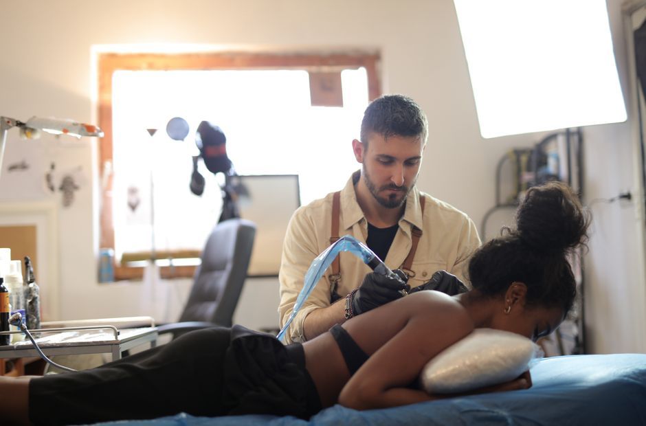 Woman receiving a back massage on a treatment table in a bright clinic room