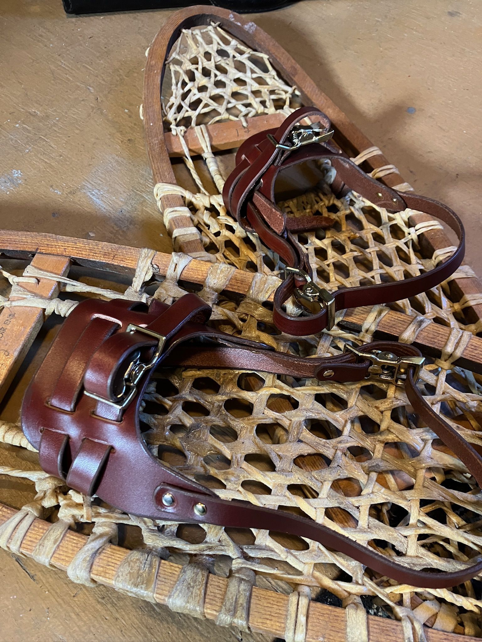Rawhide snowshoes with replacement leather bindings