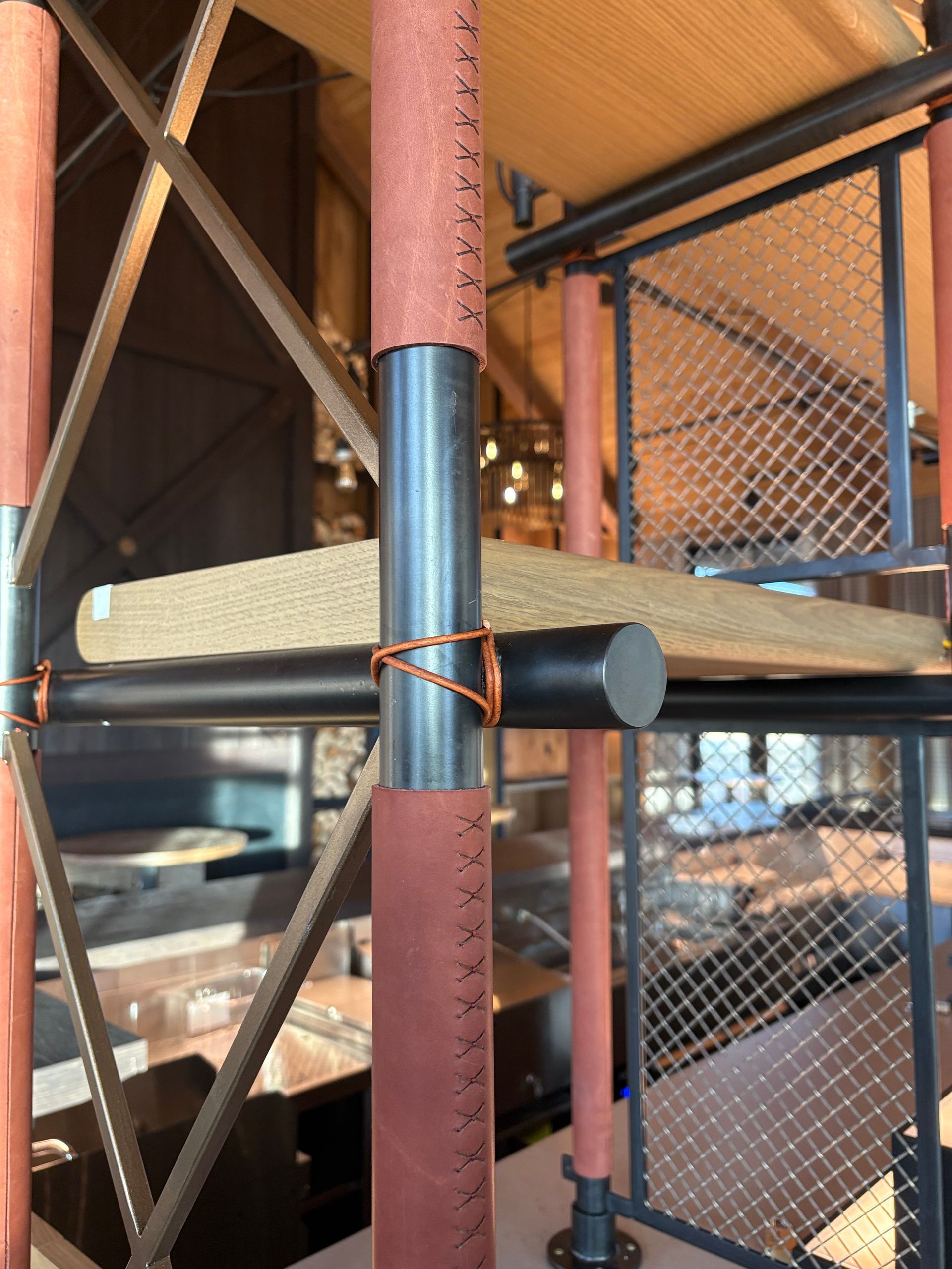 A leather wrapped shelving upright