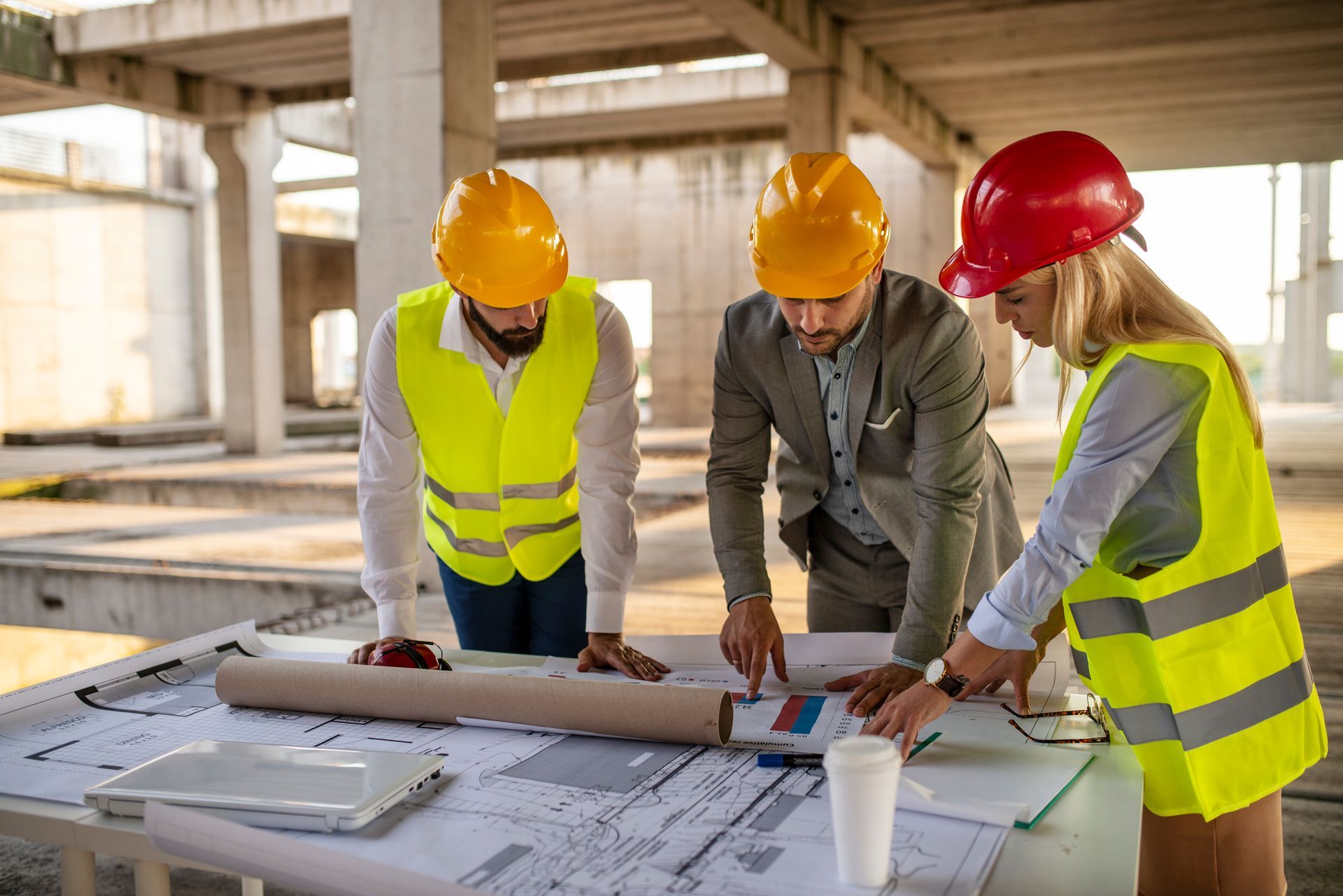 A group of engineers meeting on-site, representing a trusted civil engineering consultation company. A group of engineers meeting on-site, representing a trusted civil engineering consultation company.