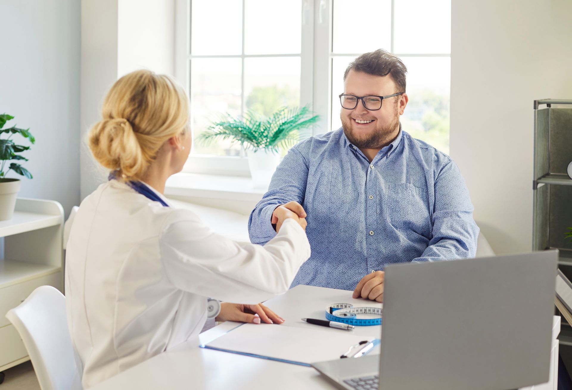 Doctor discussing a weight loss plan with a patient during a consultation
