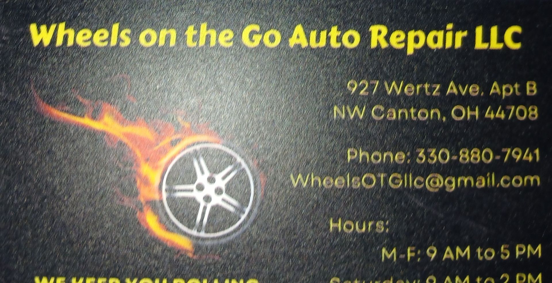 A business card for wheels on the go auto repair llc