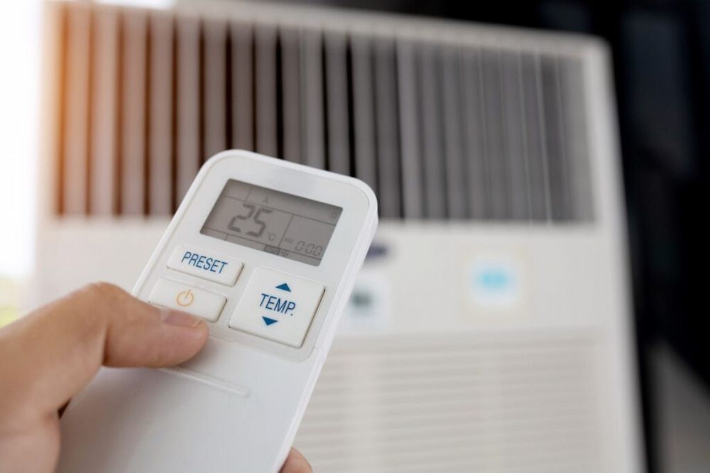 Air conditioner remote set to 25°C controlling a split system installed by Great Northern Air Conditioning & Mechanical Services in Berrimah, NT