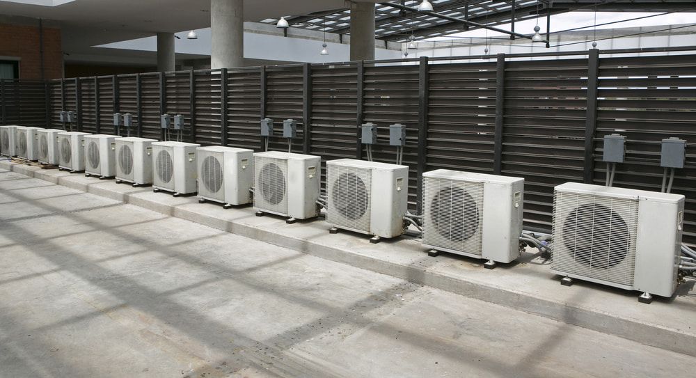 A Row of Air Conditioners Are Lined Up — Great Northern Airconditioning & Mechanical Services in Humpty Doo, NT