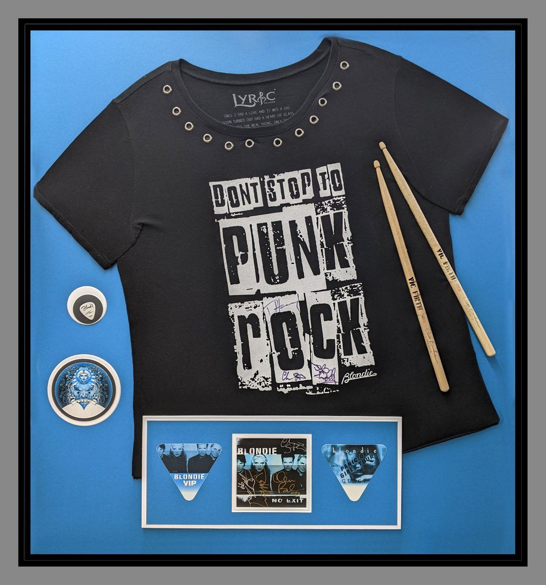 punk rock tee shirt with drum sticks