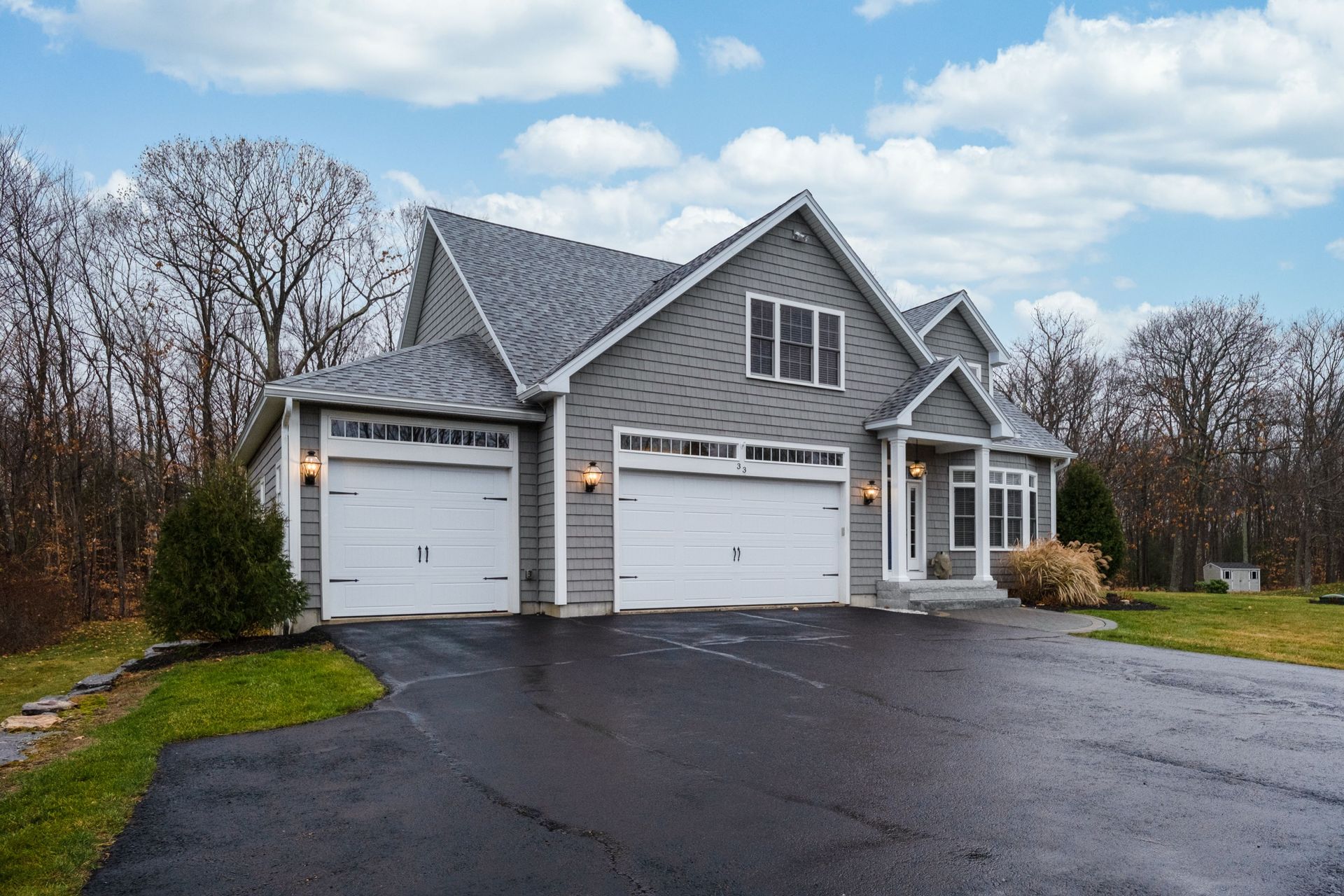 Gray House with Three-Car Garage and Asphalt Driveway — Tucker, GA — A-1 Driveway Replacement Company
