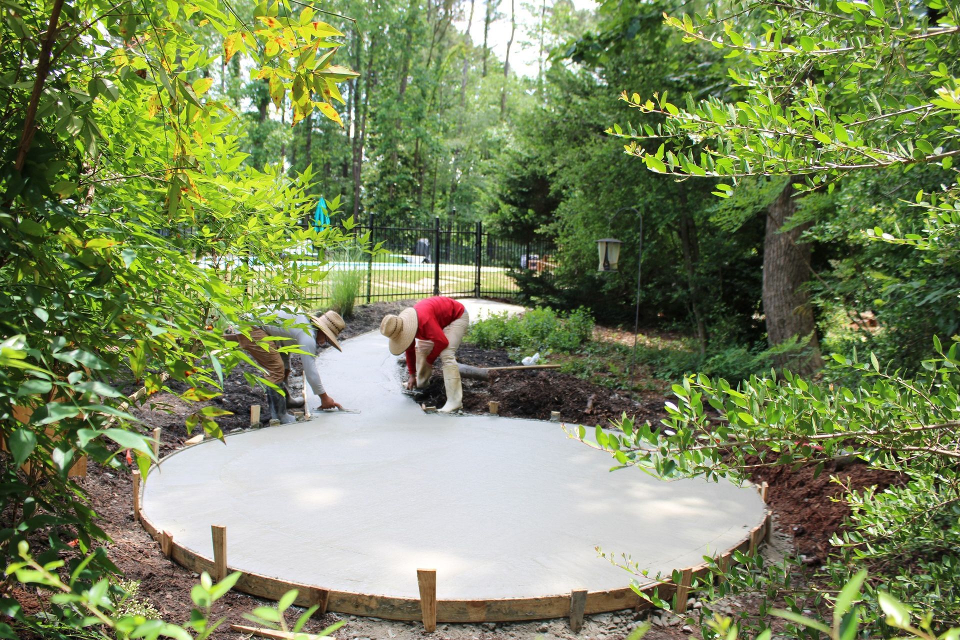 People Working On Concrete Patio.