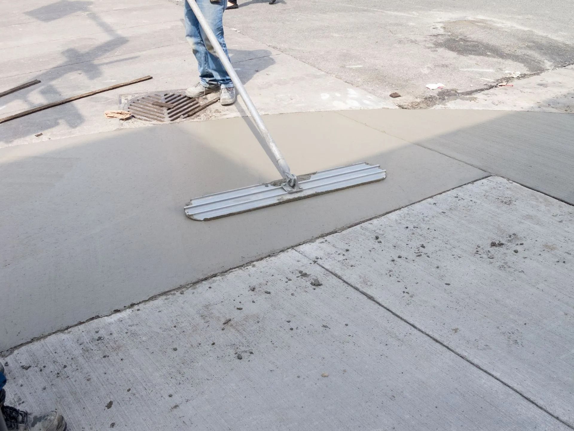 Person Smoothing Wet Concrete — Tucker, GA — A-1 Driveway Replacement Company