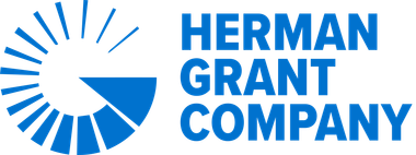 The herman grant company logo is blue and white