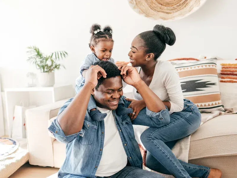 An image showing a family looking relieved and happy, symbolizing financial security through term life insurance.