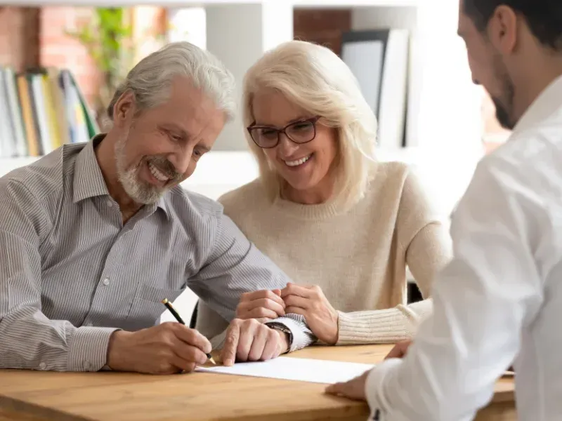 An image showing a happy family in South Carolina discussing final expense insurance options.