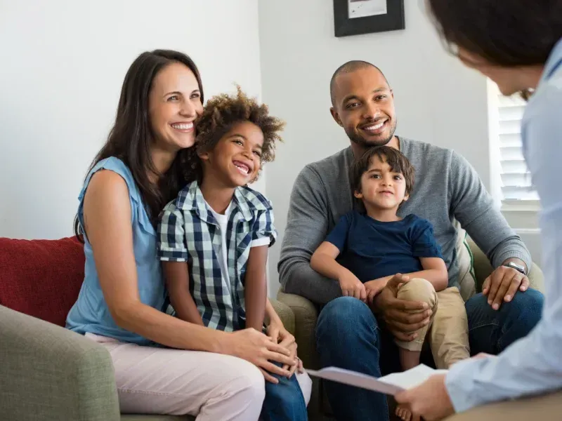 An image showing a family discussing term life insurance with an agent in South Carolina.