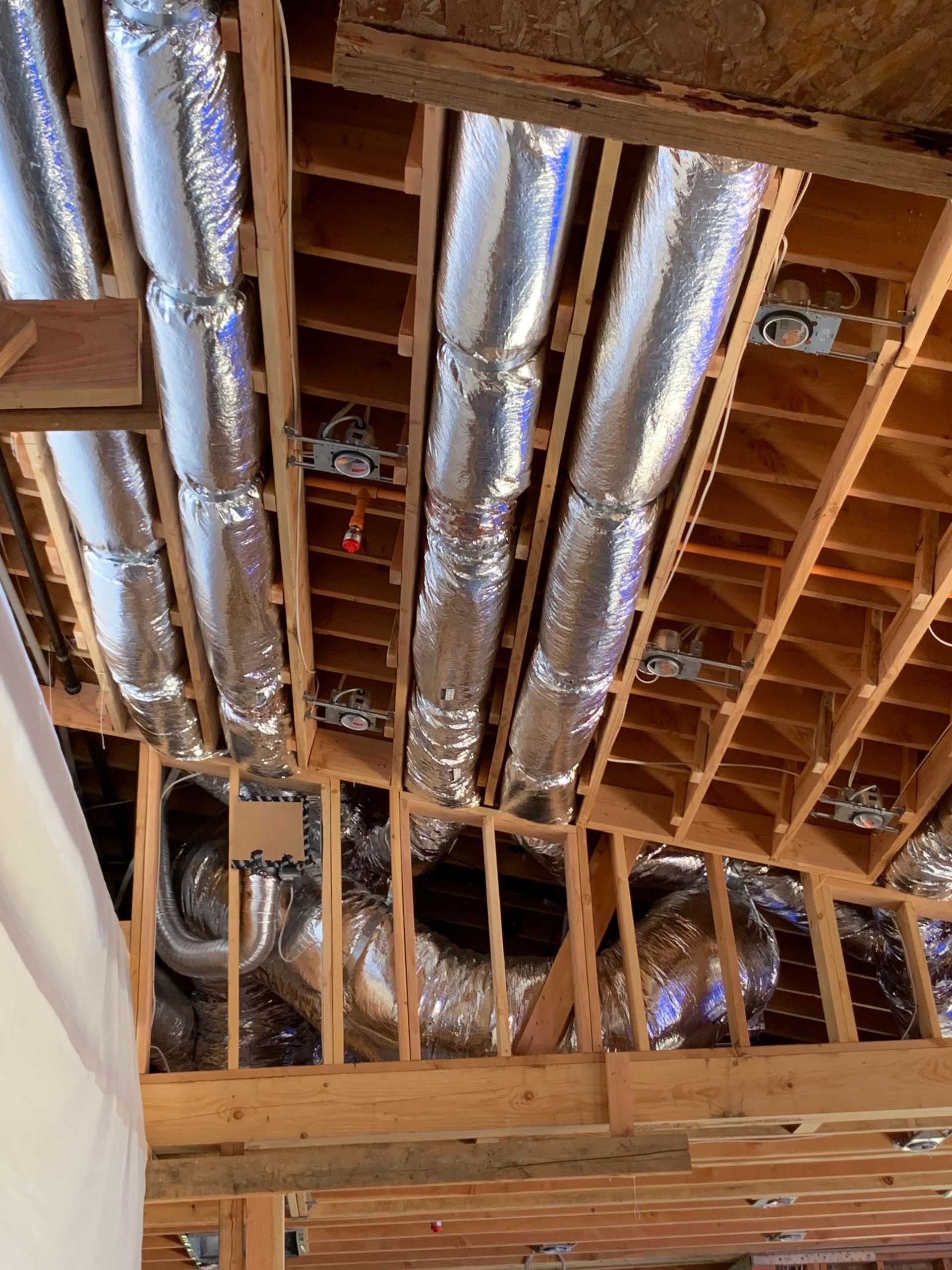 HVAC ductwork installation during new construction rough-in