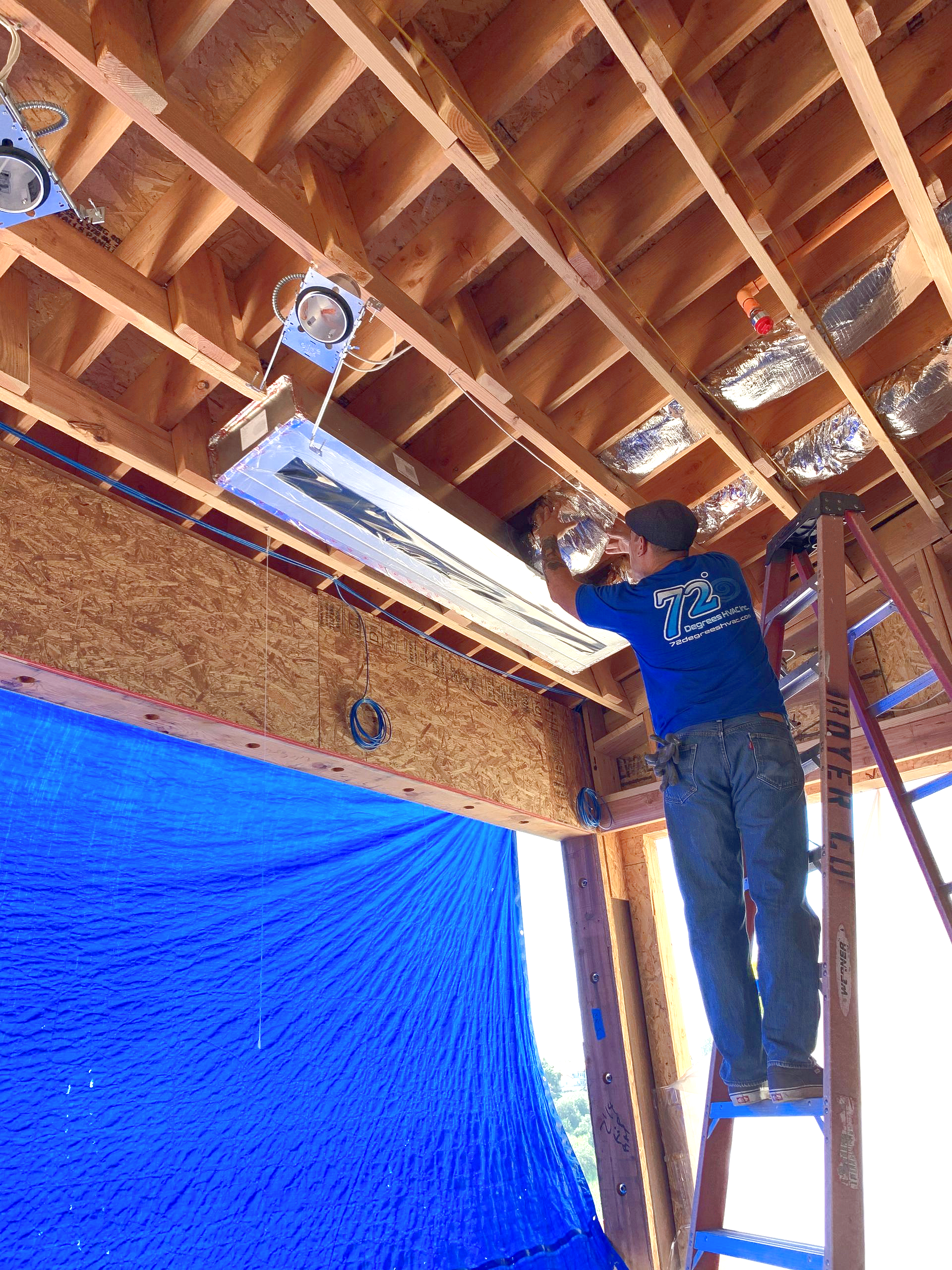 Linear HVAC vent installation during the rough construction stage
