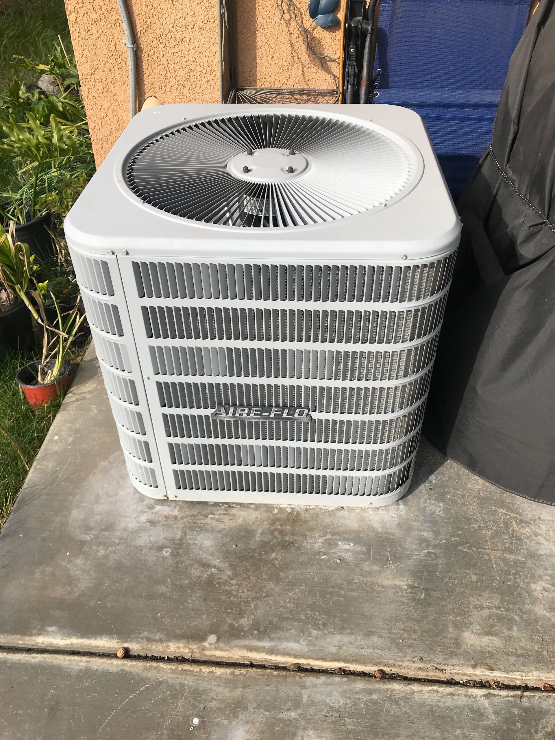 Before condenser relocation at residential HVAC project