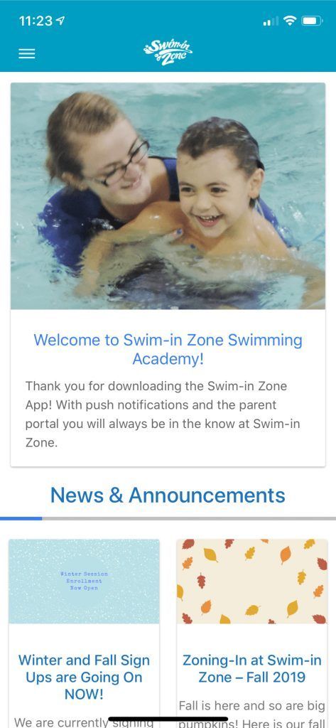 A woman is teaching a boy how to swim on a phone screen.