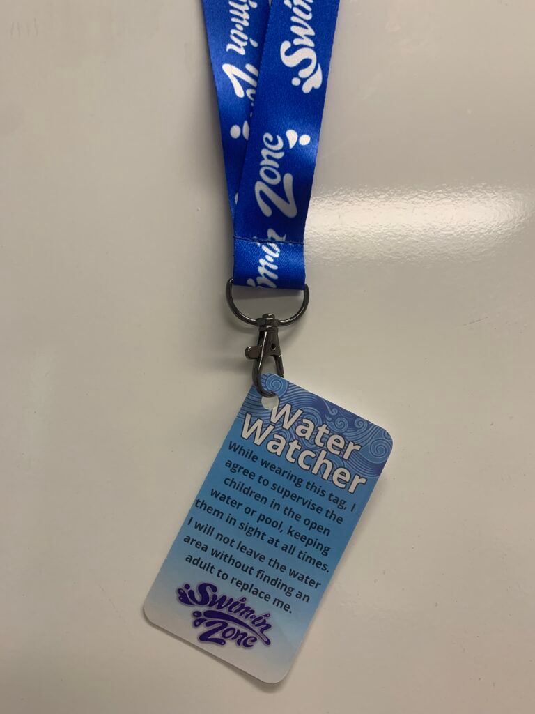 A blue lanyard with a water watcher tag attached to it