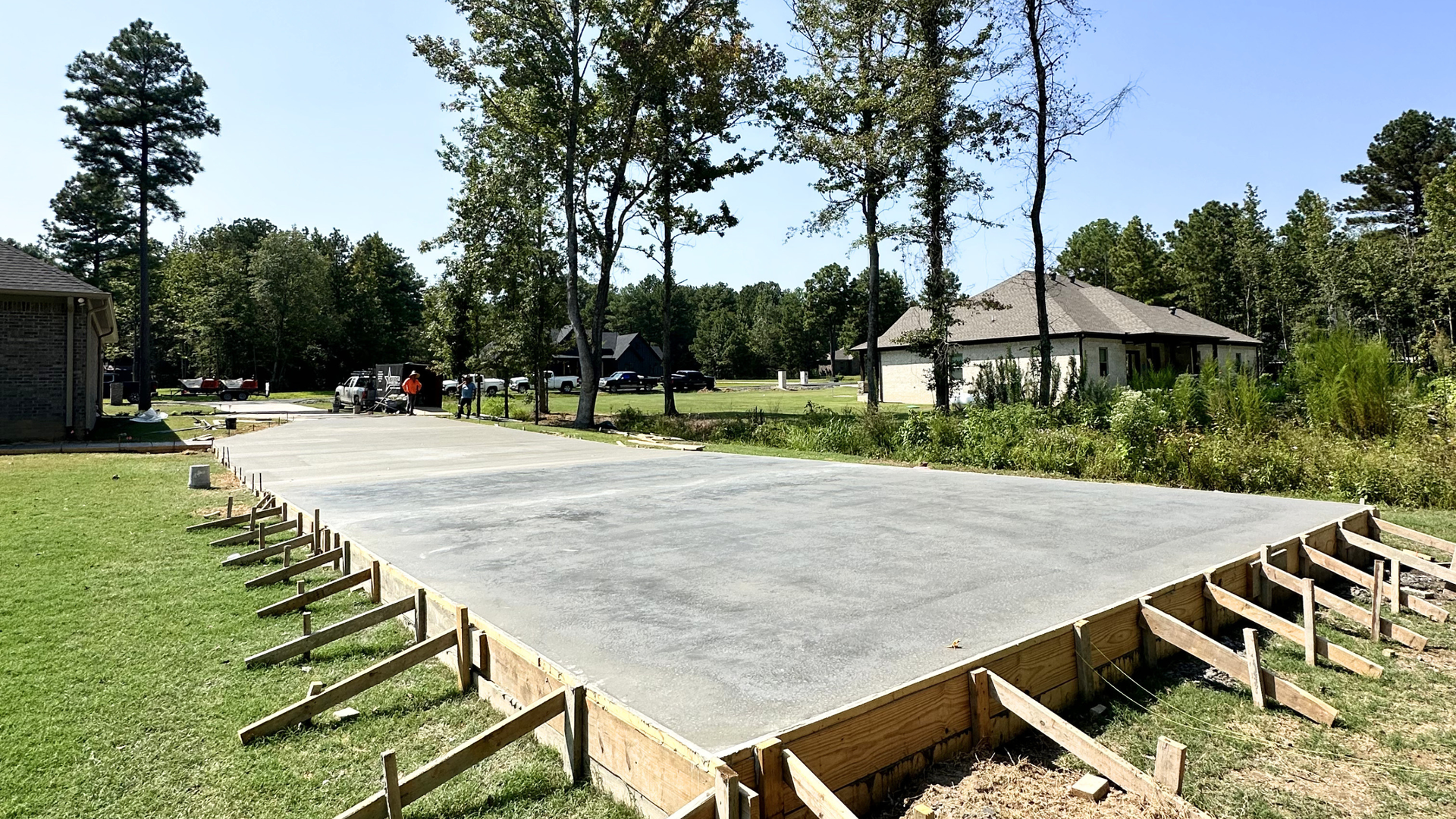Freshly poured residential concrete slab curing on a mild Central Arkansas day