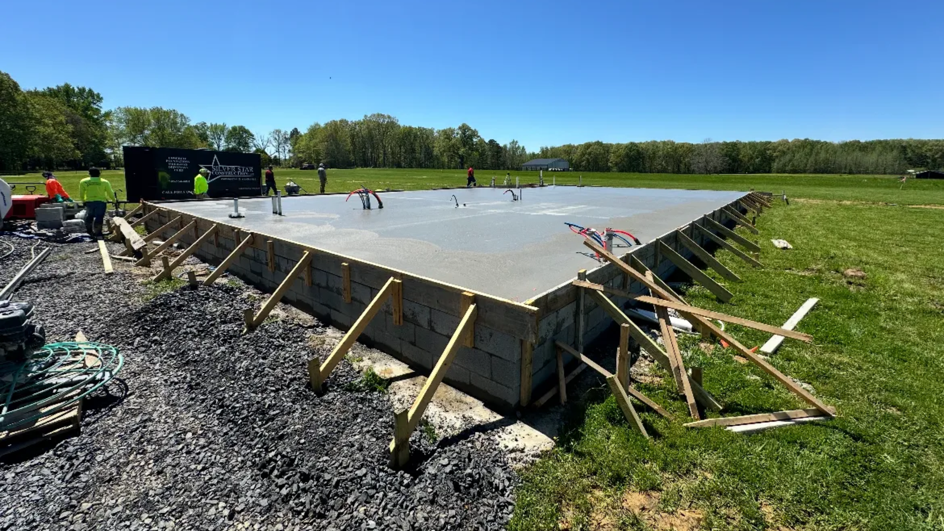Freshly poured monolithic slab foundation at a Little Rock area home site