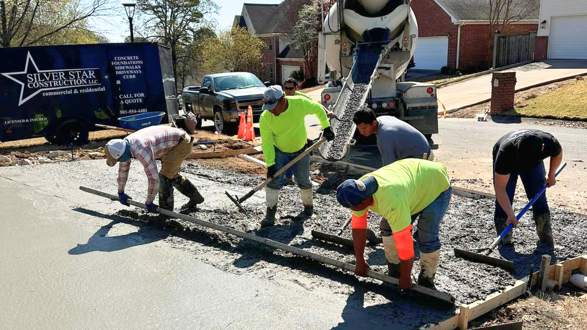 Crushed aggregate base being compacted before a concrete walkway pour