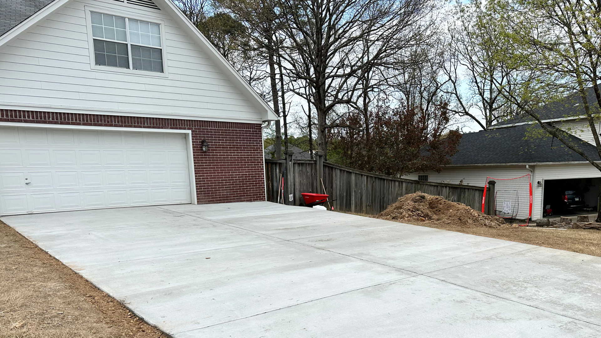 Concrete crew pouring a residential slab on a clear, cool Central Arkansas winter day