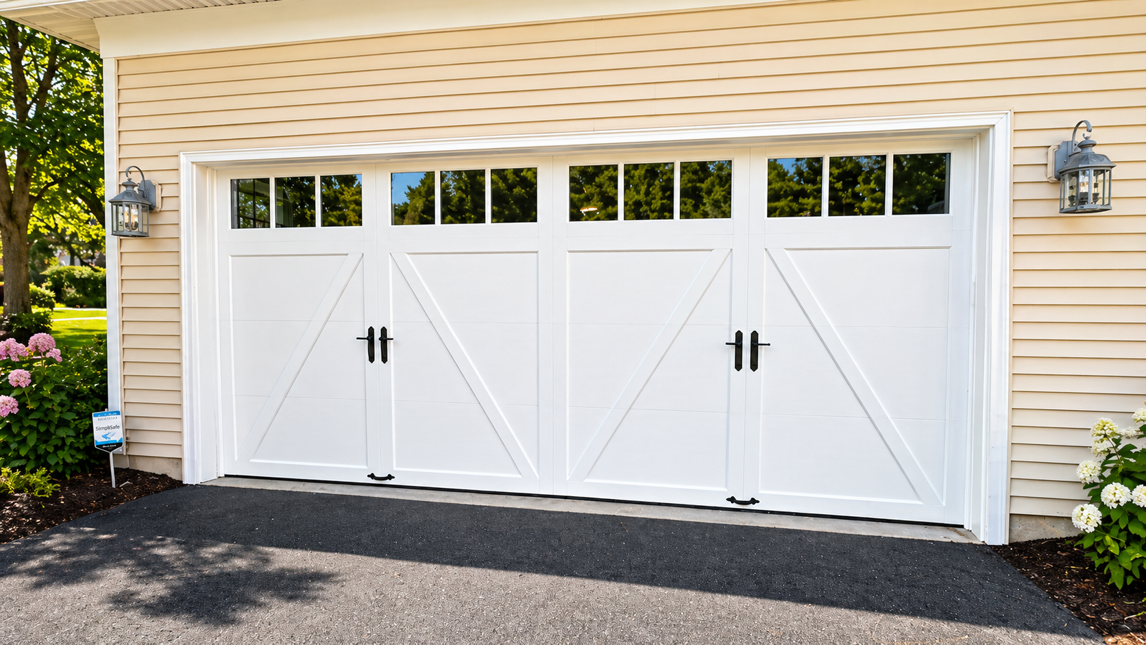 Garage wall with mounted garage door opener hardware, tracks, and a car roof in the foreground Garage wall with mounted garage door opener hardware, tracks, and a car roof in the foreground