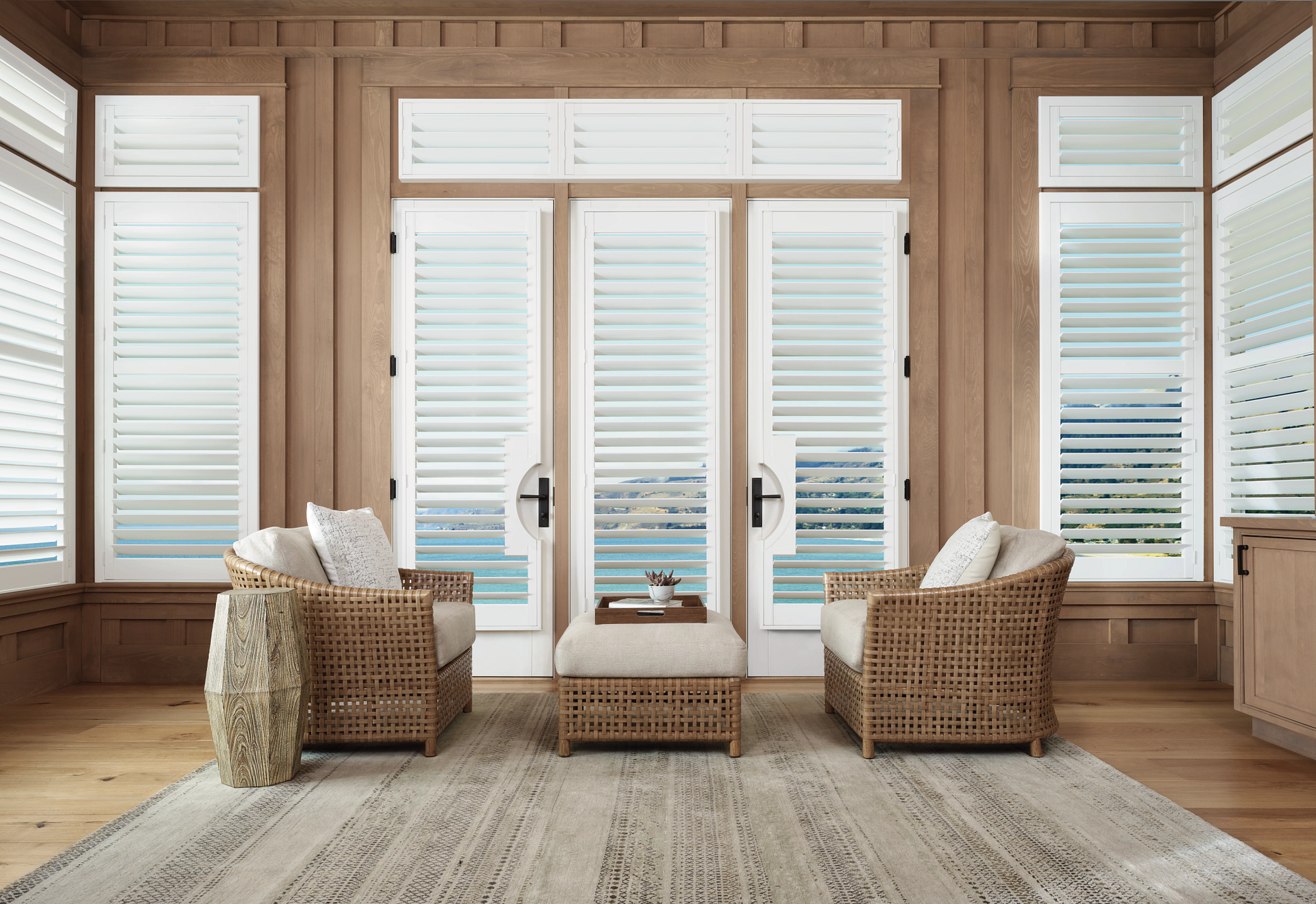 Hunter Douglas Palm Beach™ Polysatin™ Shutters in a coastal-themed room.