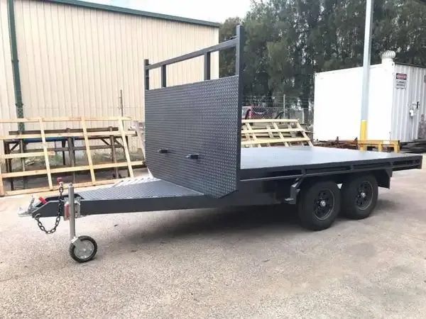 A Trailer Is Parked On The Side Of The Road In Front Of A Building — Hunter Powder & Paints In Singleton, NSW