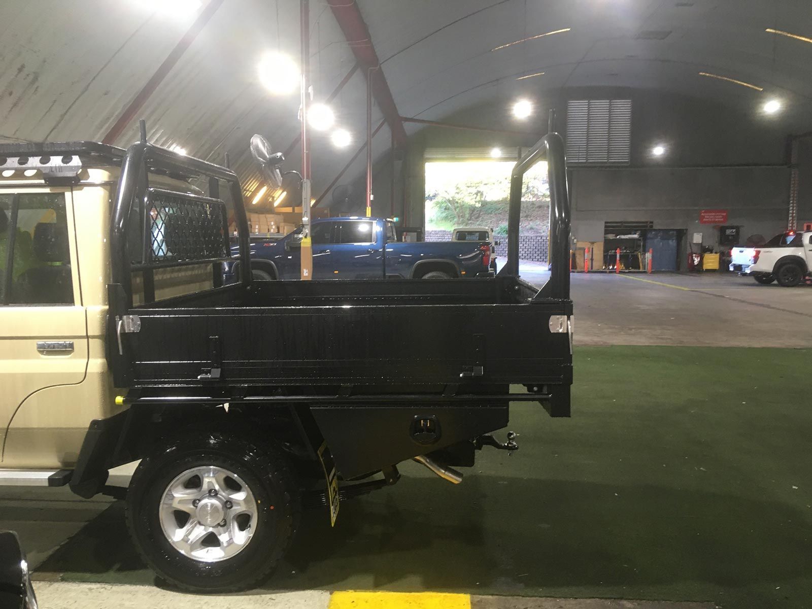 A Truck Is Parked In A Parking Lot In A Warehouse — Hunter Powder & Paints In Scone, NSW