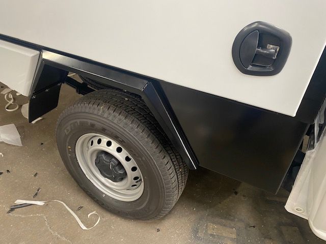 A Close Up Of A Tire On A White Truck — Hunter Powder & Paints In Central Coast, NSW