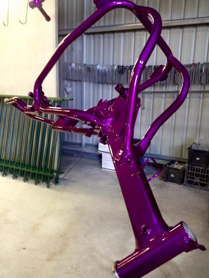 A Purple Bicycle Frame Is Sitting In A Garage — Hunter Powder & Paints In Port Stephens, NSW