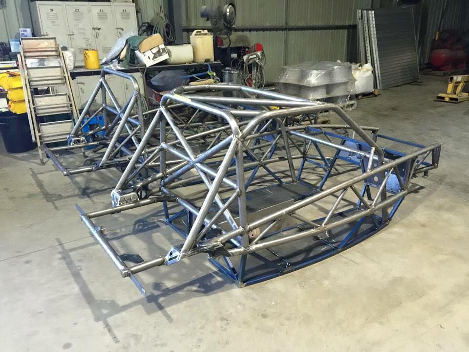 A Metal Frame Is Sitting On The Ground In A Garage — Hunter Powder & Paints In Central Coast, NSW