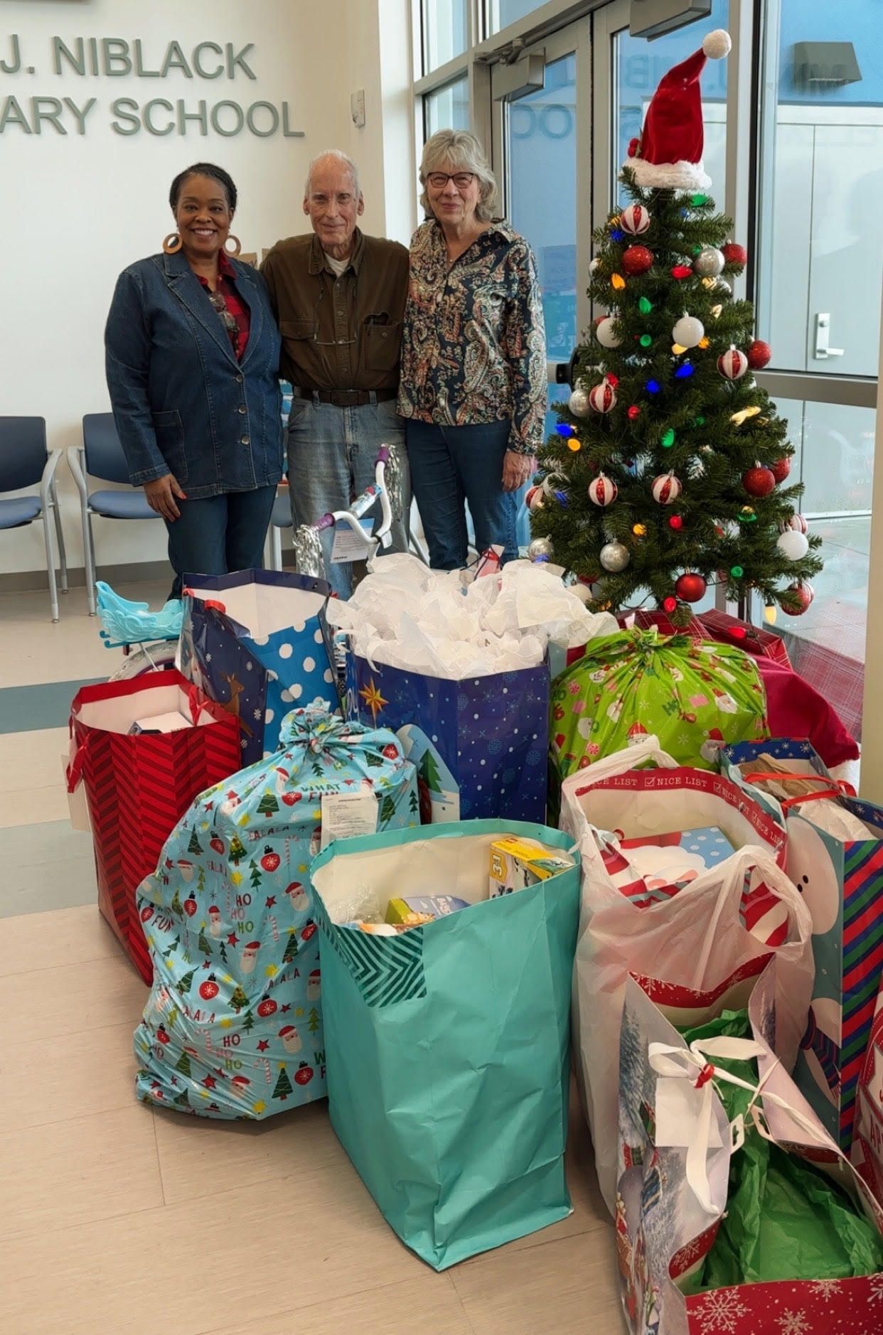 A Christmas tree with gifts for children at Niblack school