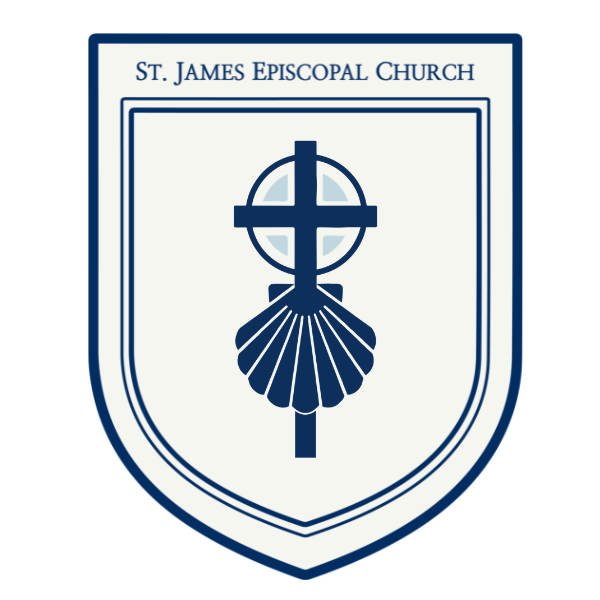 A blue cross with a scallop-shell design in the center of a pale shield