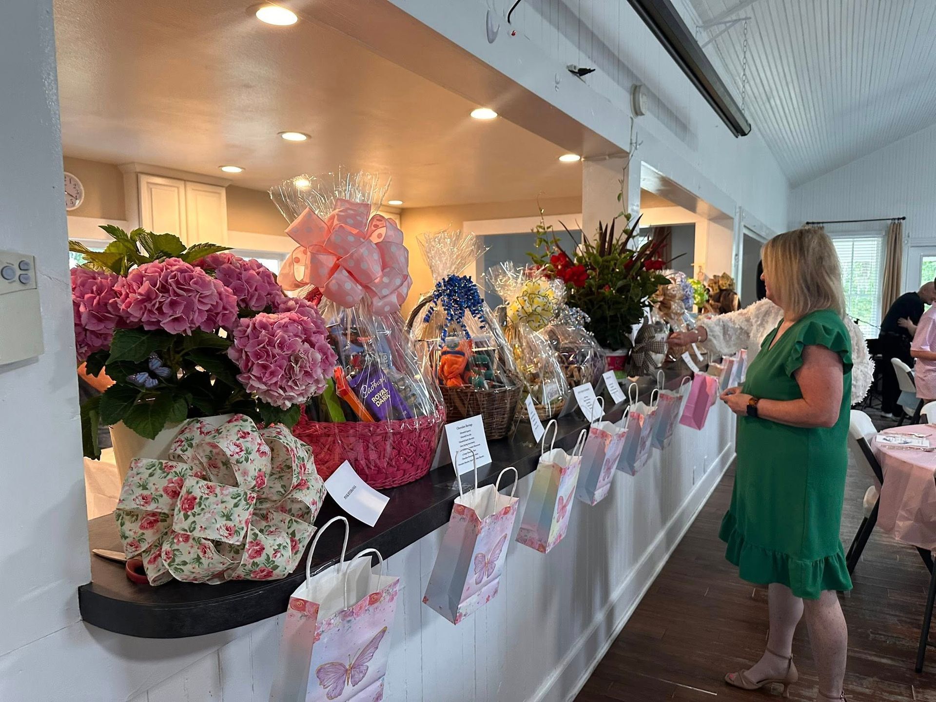 A long row of flowery baskets in a line