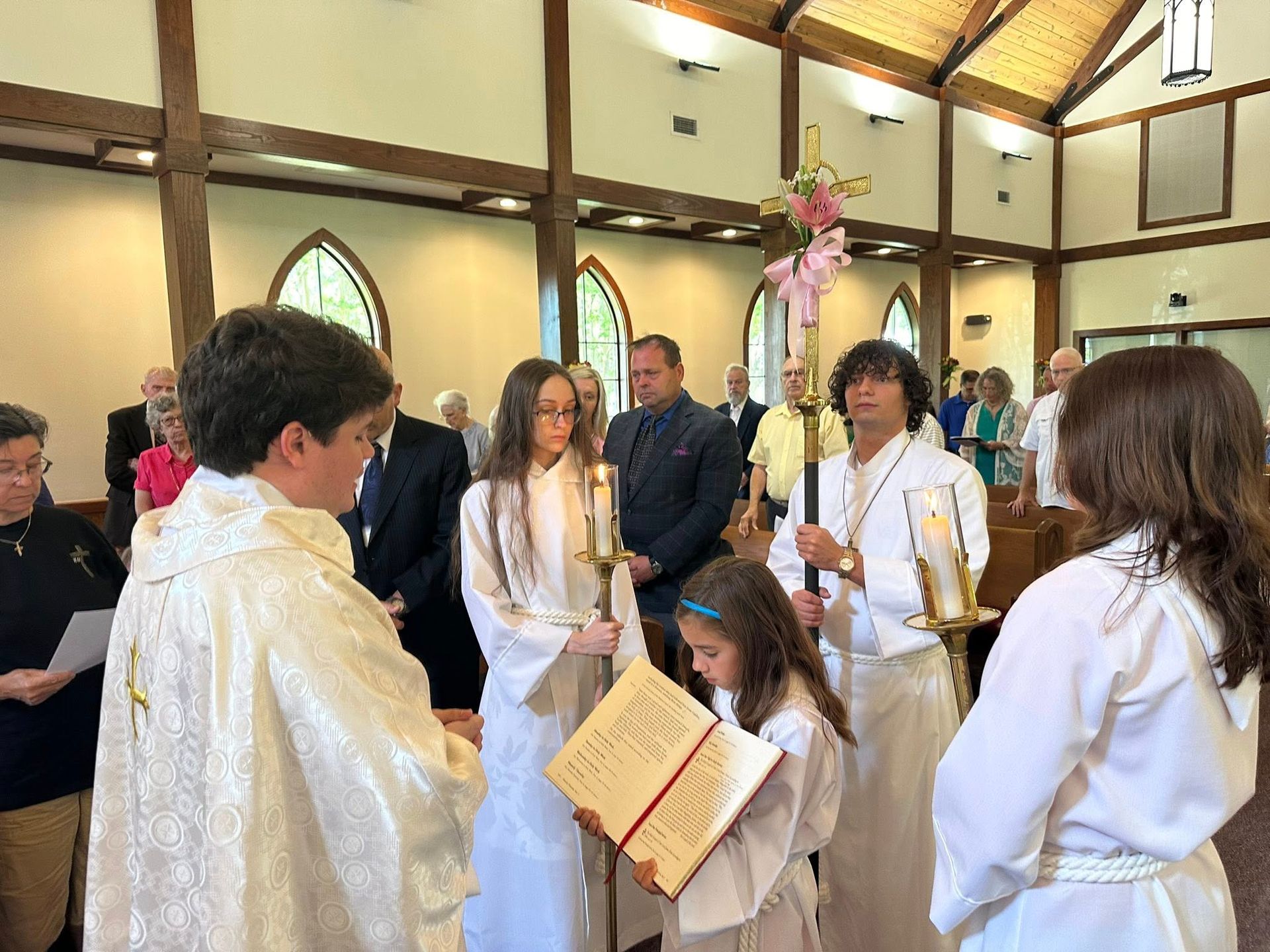 The Gospel is read during worship service in the Santuary at St. James during Eastertide