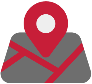 A red map pin icon sitting on top of a stylized gray map with red roads.