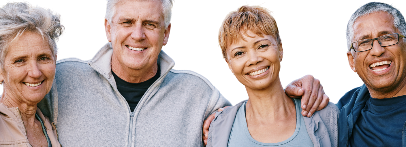 Four people standing in a row, smiling and posing with their arms around each other against a white background.