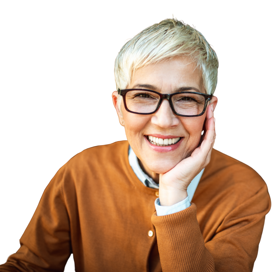 A smiling person wearing glasses and a mustard-yellow cardigan, resting their chin on their hand.