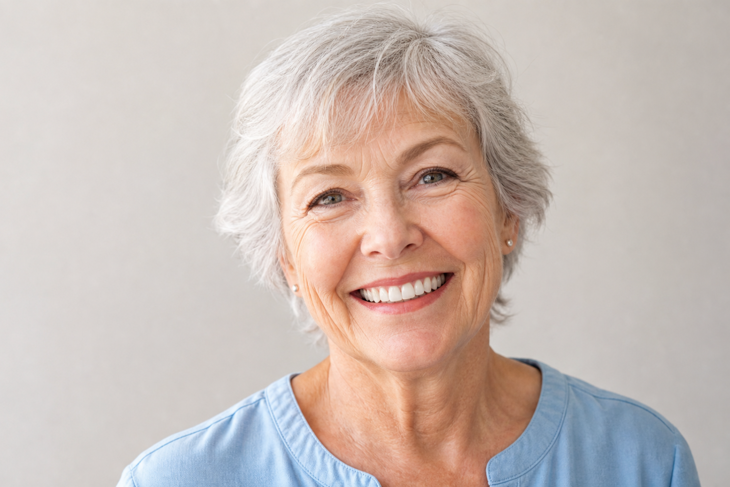 Confident smile with well-fitted dentures, showing when it's time for a replacement check.