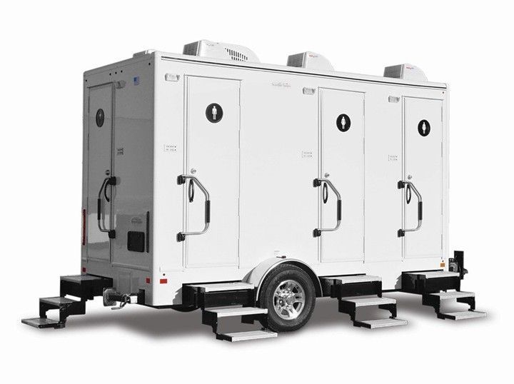 Portable restroom trailer on an outdoor site.