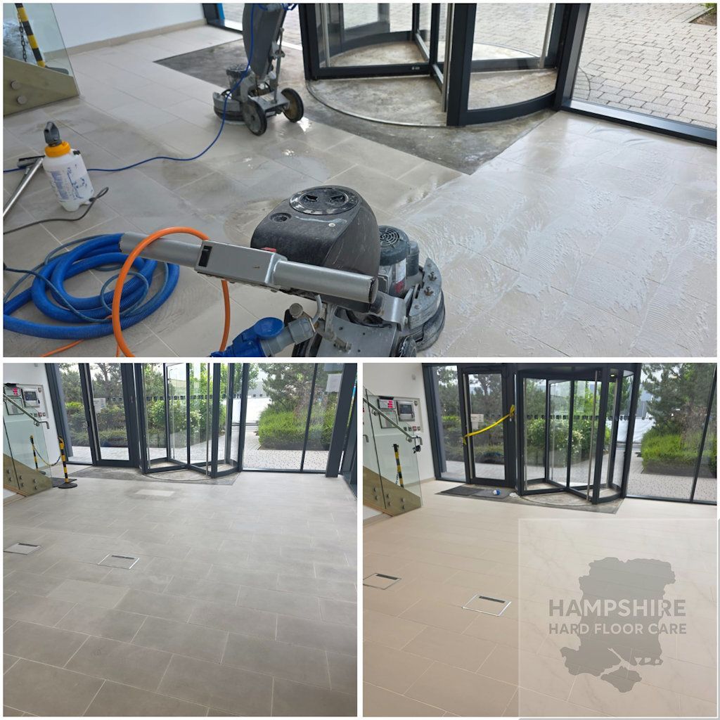 Ceramic tiles being machine-scrubbed to remove grout haze and surface contamination