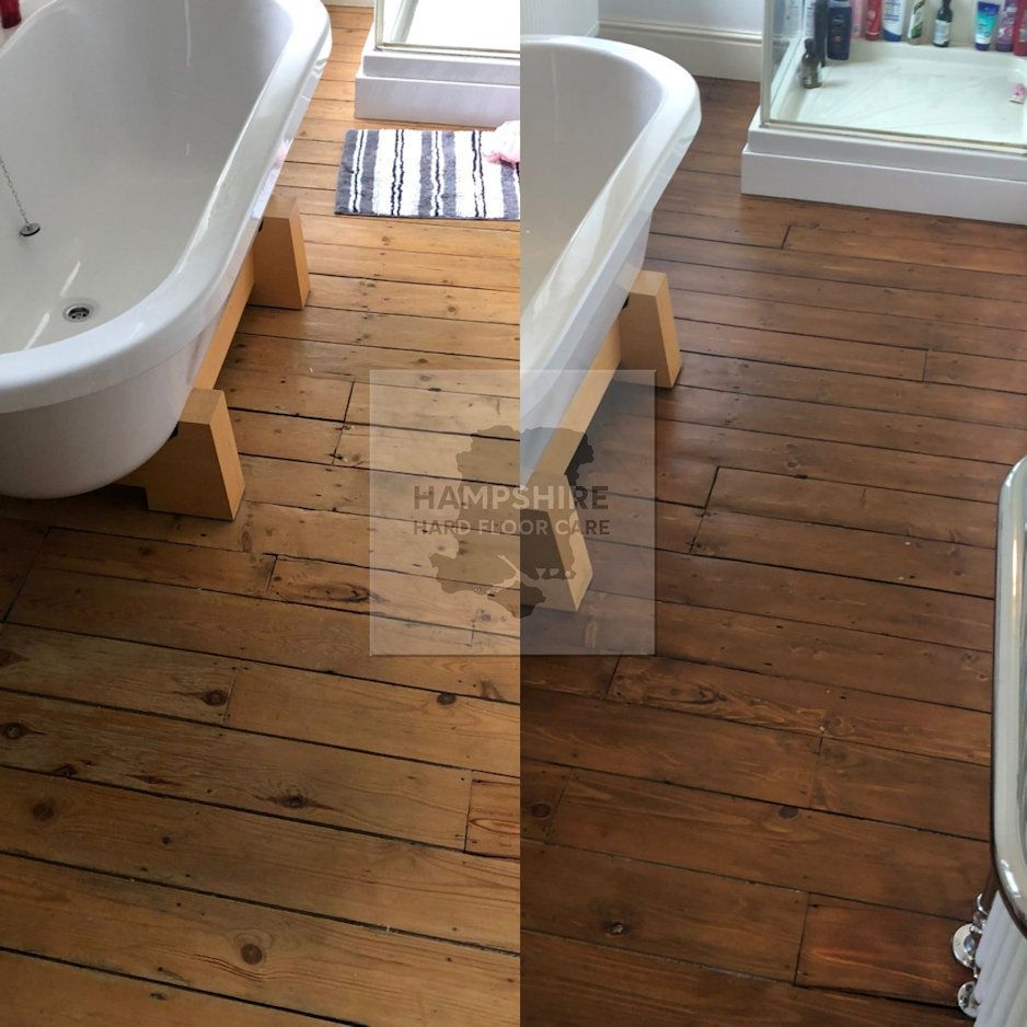 Professional sanding equipment smoothing worn wooden floor