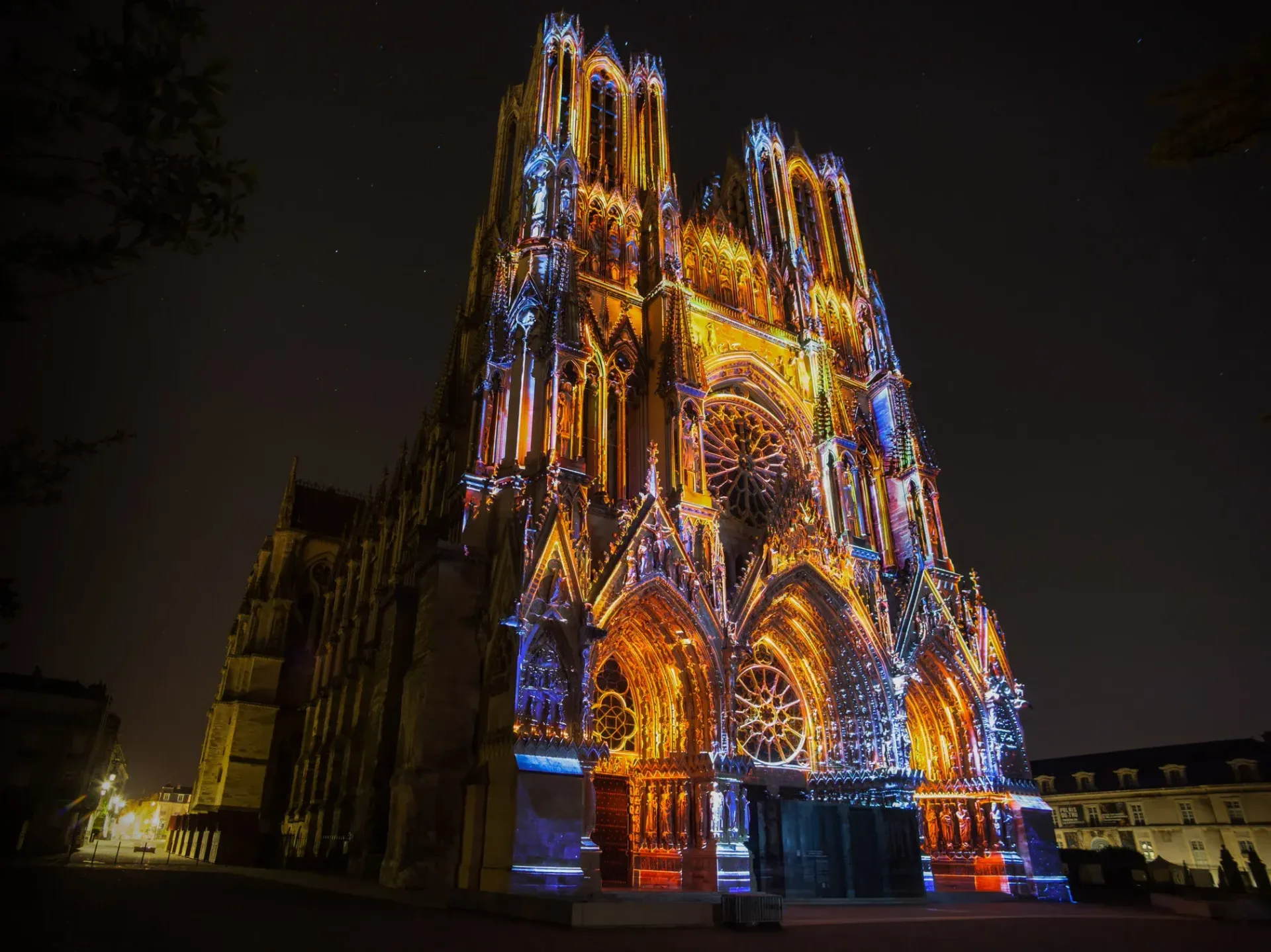 A large building with a lot of lights on it at night