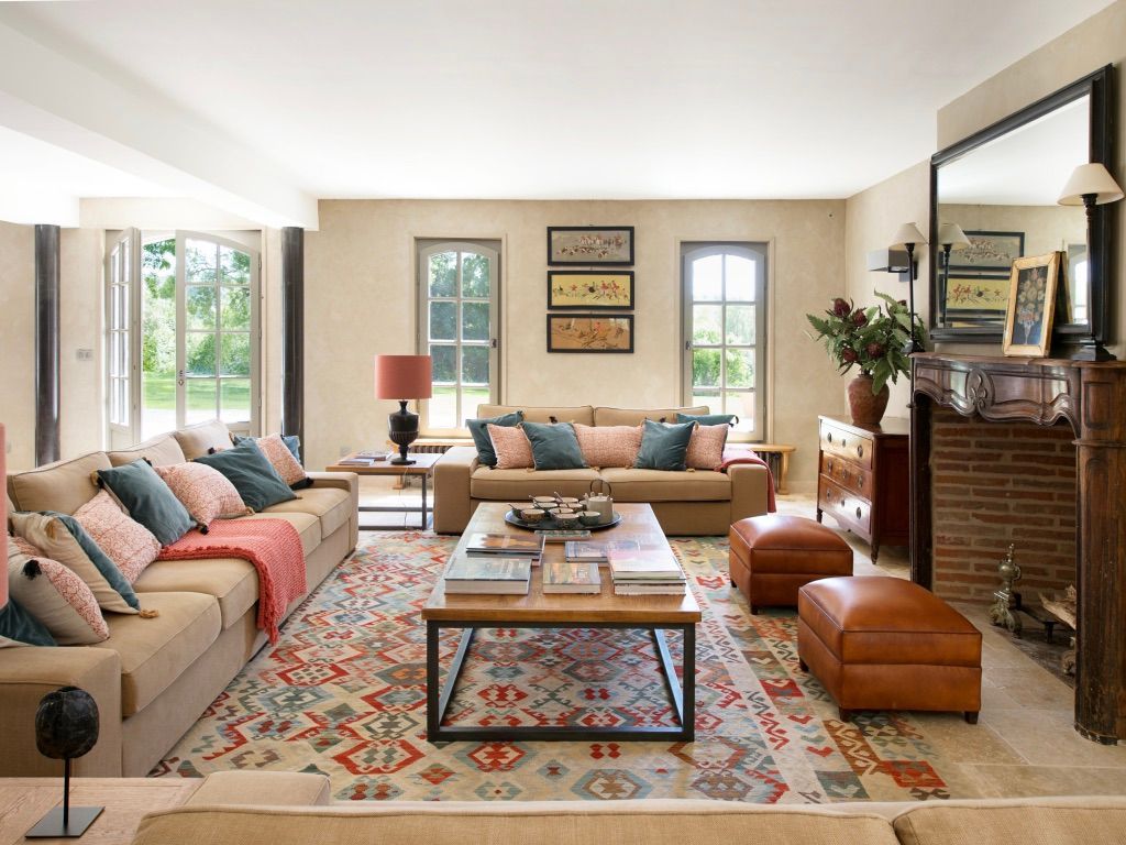 A living room filled with furniture and a fireplace.