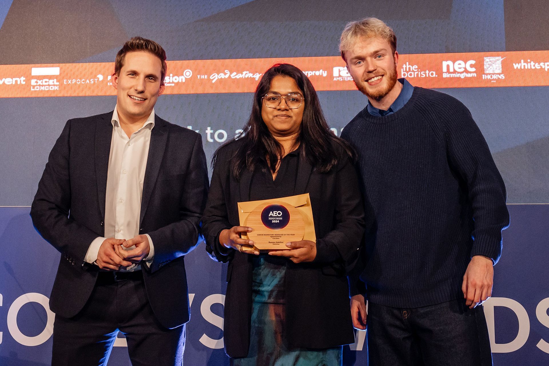 Herbert Jan Hamersteen preseting the People's Award for Senior Marketing Manager to Ramya Jawahar of Informa