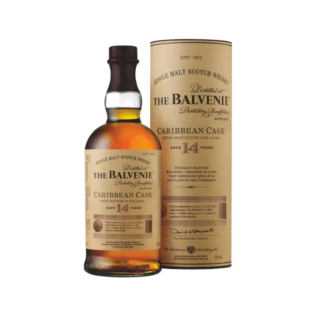 Bottle of The Balvenie Caribbean Cask 14 Year Old single malt Scotch whisky next to its cardboard tube.