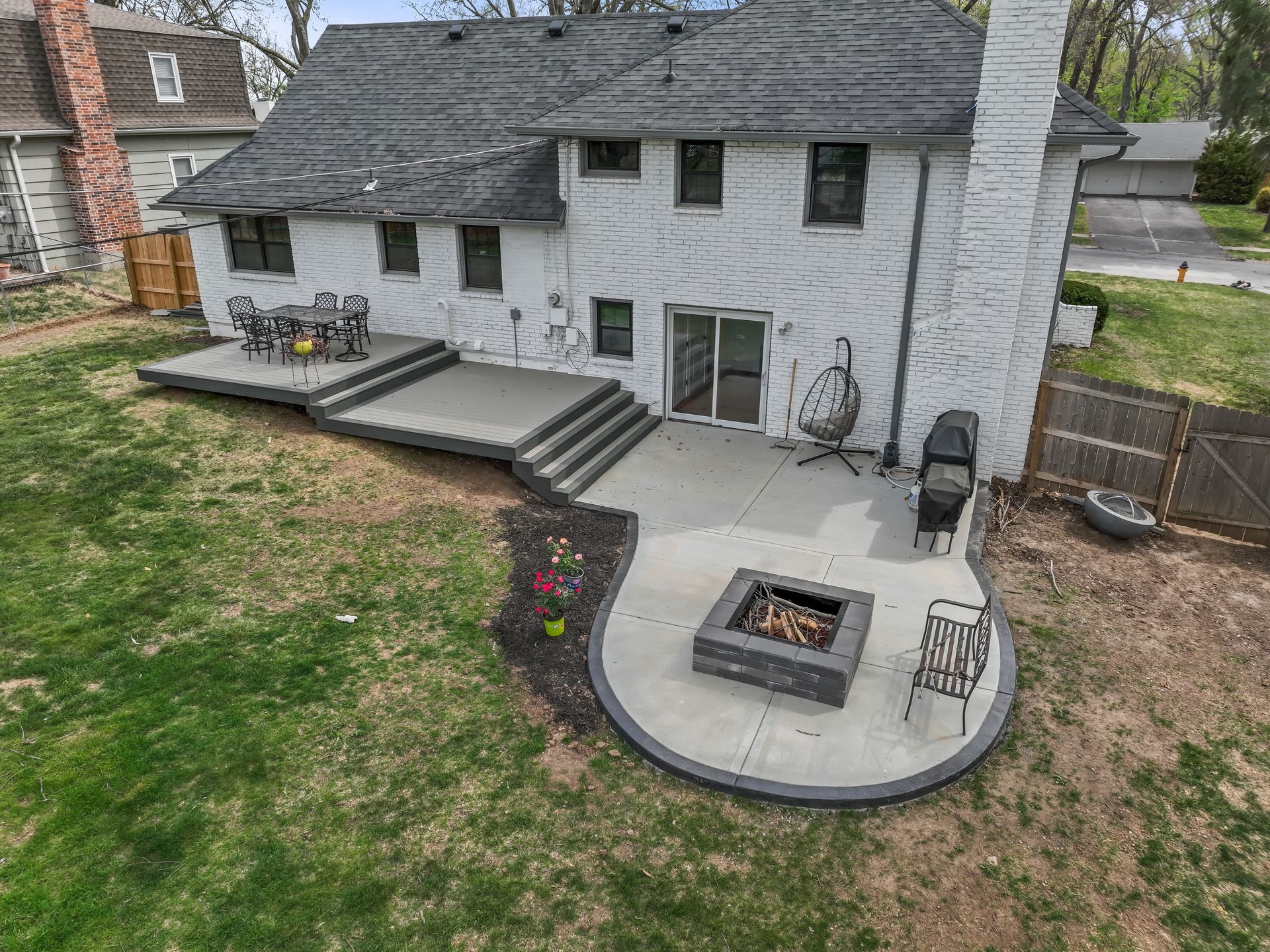 Patio with Fire pit, Chairs, and Wooden Deck