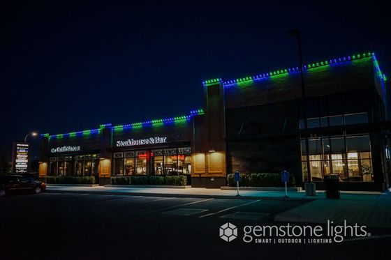 Gemstone Lights installed on a commercial strip mall building