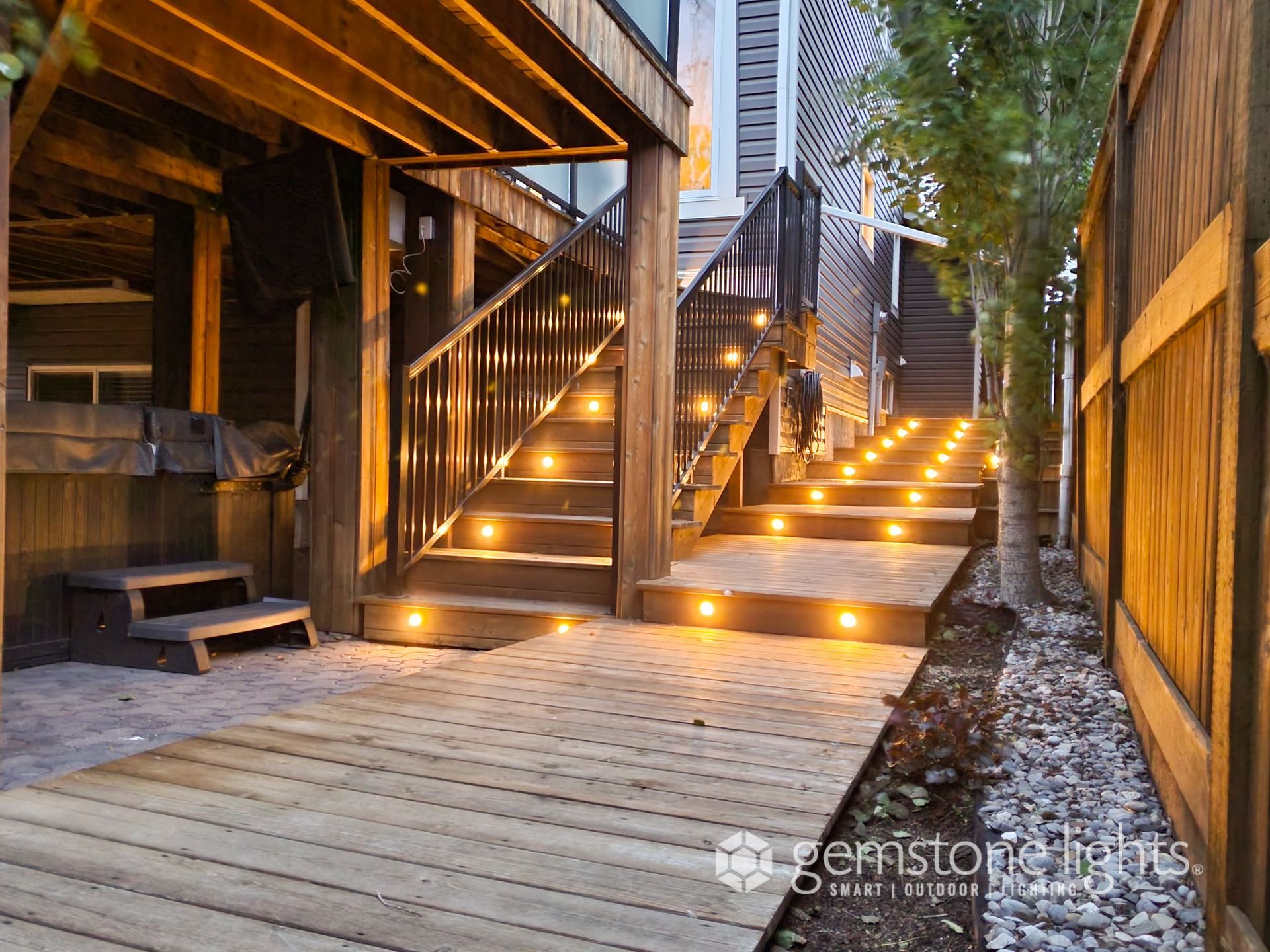 Deck lighting installed in stairs and fencing
